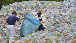 This photo taken on July 16, 2018 shows volunteers sorting out plastic bottles at a recycling centre run by a non-profit Buddhist organisation in Taipei.
Taiwan started recycling plastic more than a decade ago and today it boasts more than 70 percent recycling rates, according to the Environmental Protection Administration. / AFP PHOTO / Chris STOWERS